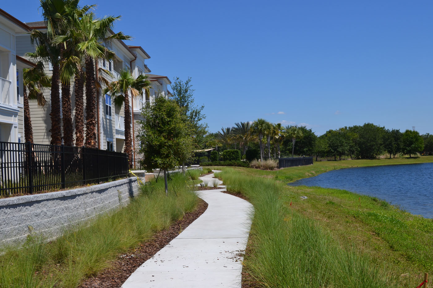Highland Park Apartments pathway near water