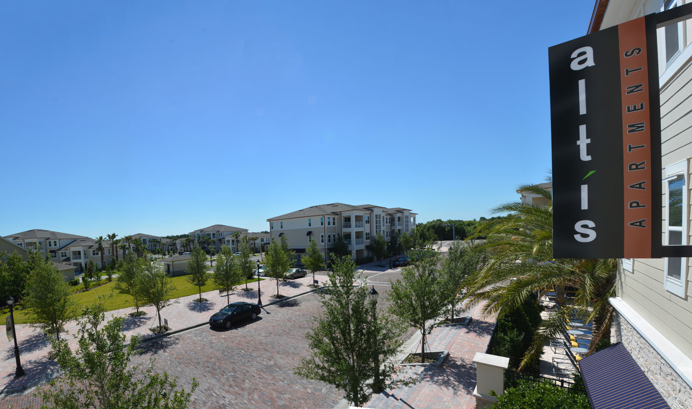 altis apartments sign with buildings Panorama