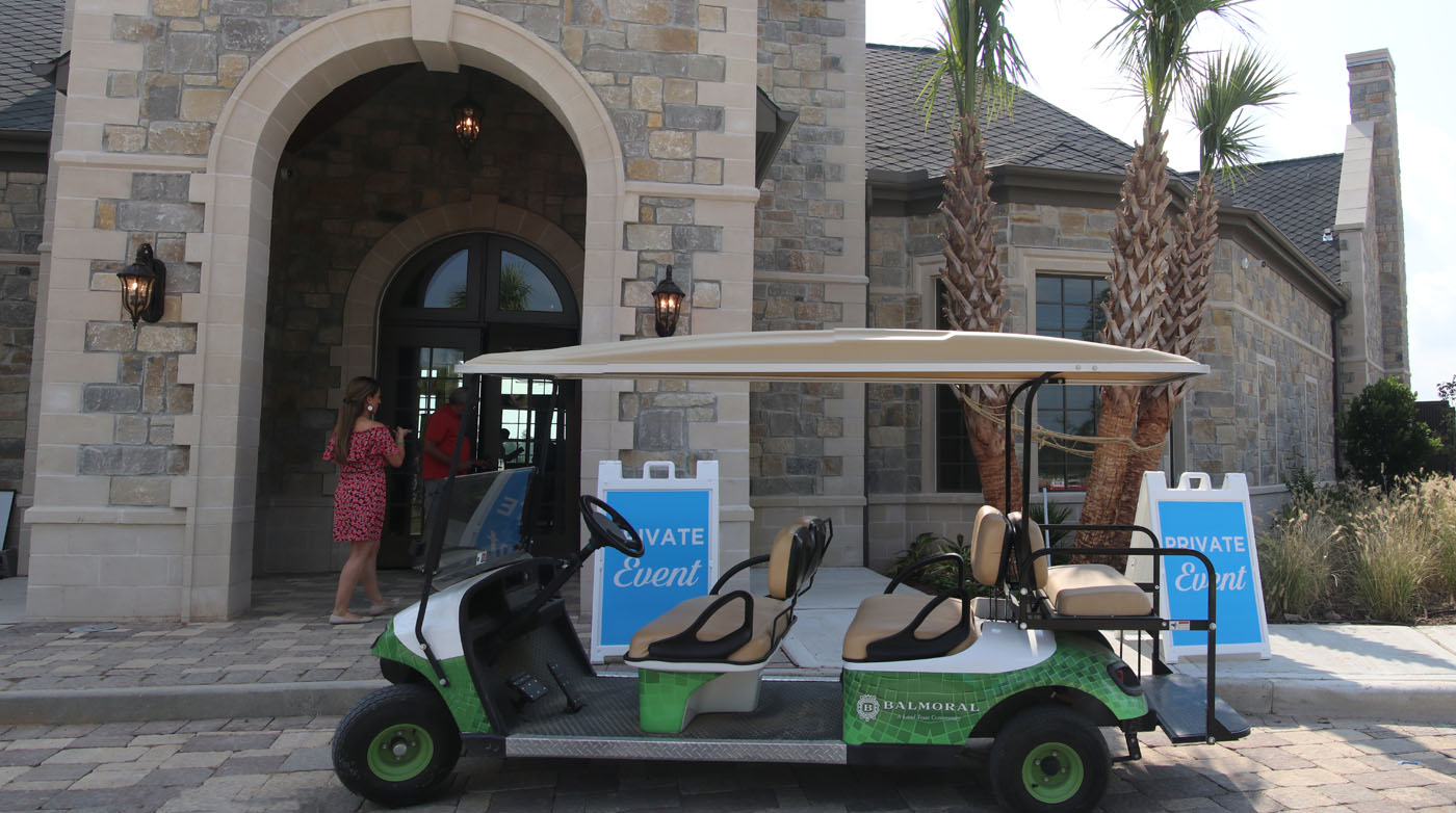 Balmoral Golf Cart in front of building